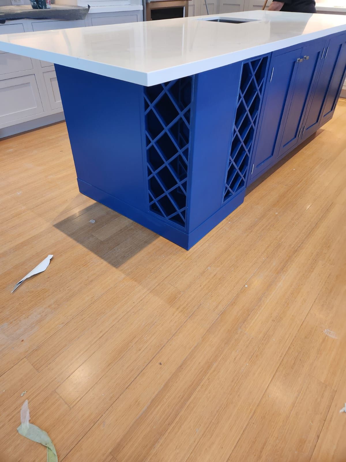 Island cabinetry and hardwood flooring after installation