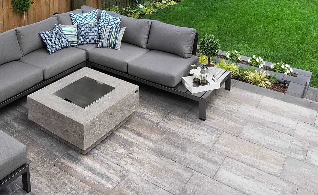 Paver patio with outdoor seating and a fire table